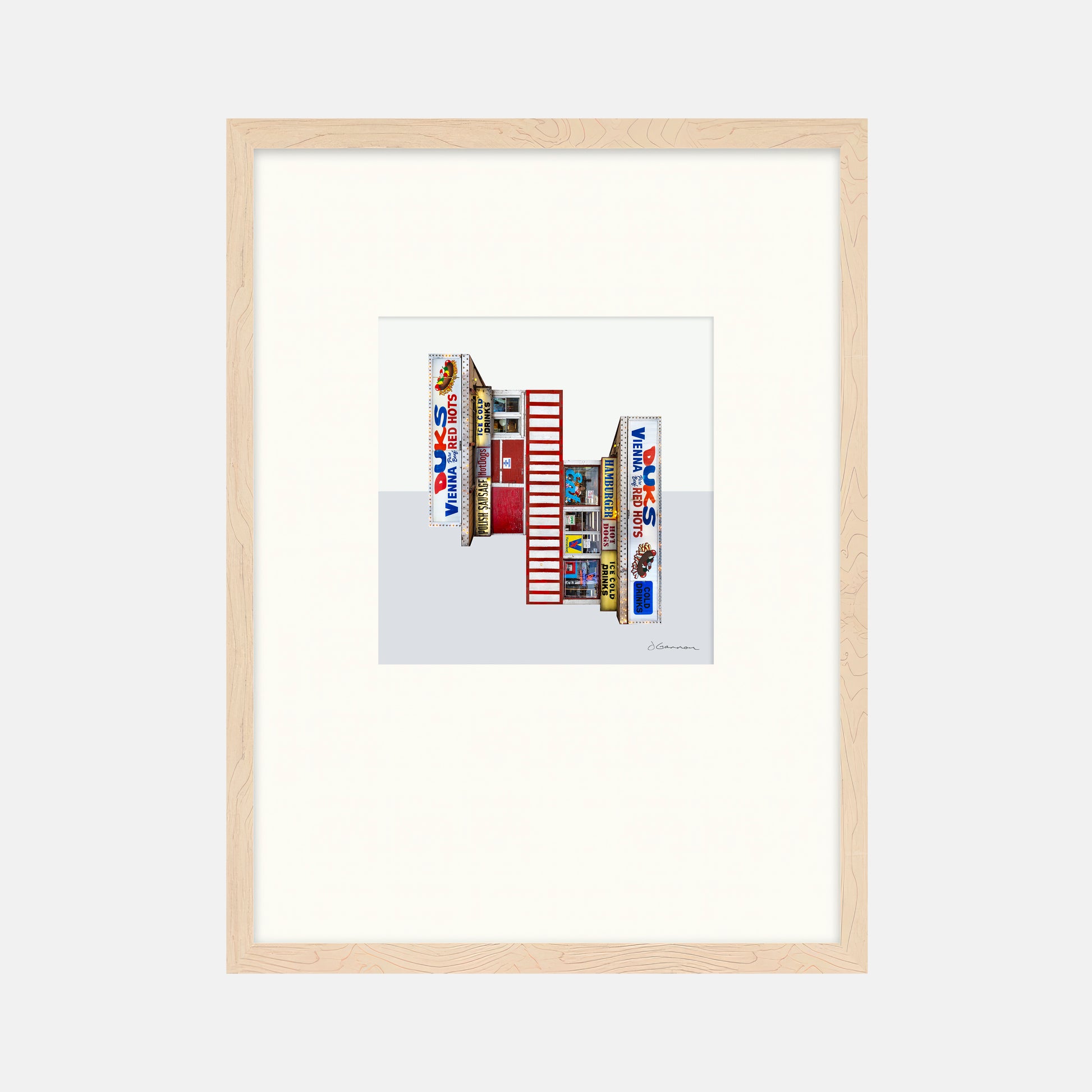 Framed artwork of a colorful building facade with 'Duks' branding on a white background