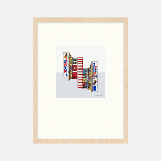 Framed artwork of a colorful building facade with 'Duks' branding on a white background